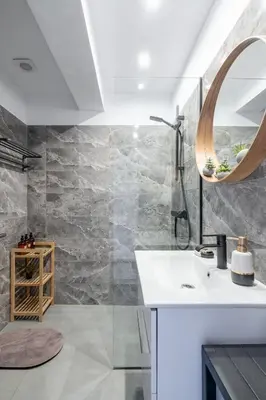 a bathroom with a sink and a mirror at Glyfada center seaview B in Athens