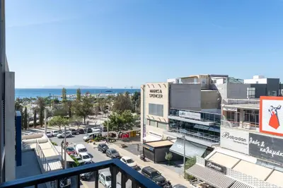 a view of a city street with cars and buildings at Glyfada center seaview B in Athens
