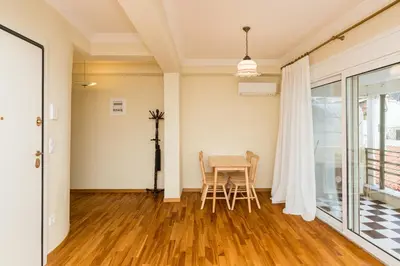 a dining room with a table and chairs at Acropolis Aura Vintage Stays in Athens in Athens