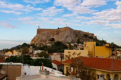 a castle on top of a mountain above a city at Acropolis Aura Vintage Stays in Athens in Athens