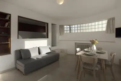 a living room with a couch and a table at Central Athenian penthouse Acropolis in Athens