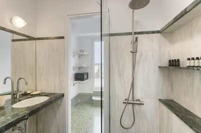 a bathroom with a shower and a sink at Central Athenian penthouse Acropolis in Athens