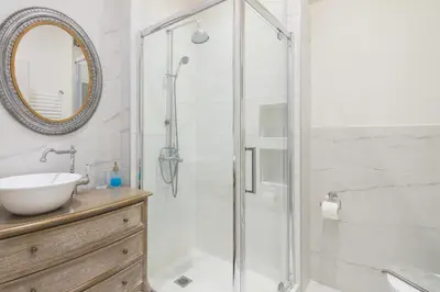 a bathroom with a shower and a sink at Athens TAN Luxury Apartment In City Center 78m2 in Athens