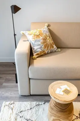 a living room with a couch and a table at Votsala Deluxe & Modern Apartments in Piraeus in Piraeus
