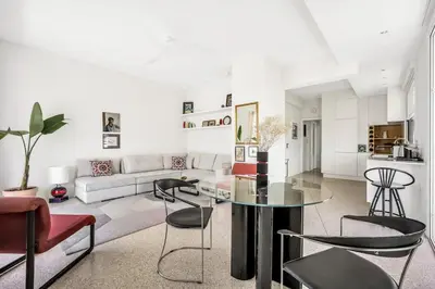 a living room with a table and some chairs at Designer comfy penthouse, Pagrati-