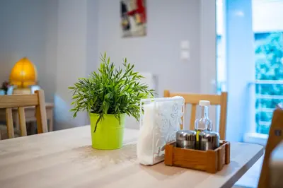 a green potted plant sitting on top of a table at Suite home in Athens