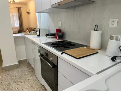 a kitchen with a stove and a counter top at Primavera 2 bedrooms apartment in Athens