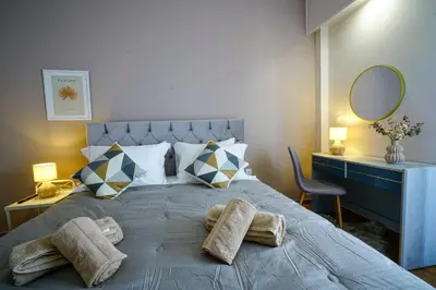 a bedroom with a large bed with towels on it at central elegant apartment in koukaki,near acropoli in Athens