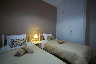 two beds sitting next to each other in a bedroom at central elegant apartment in koukaki,near acropoli in Athens