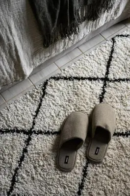 a pair of slippers on the floor of a bathroom at Piraeus Gem - Netflix, Nespresso and Style in Piraeus