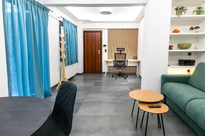 a living room with a couch and a table at Fix Central Athens Nomads in Athens
