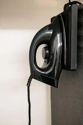 a black camera hanging on a wall at Fix Central Athens Nomads in Athens