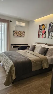 a bedroom with a large bed in a room at Mark2 by Apollo in Markopoulo