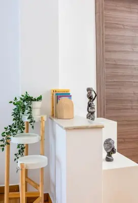 a room with a counter with two stools and a book at Nataly's Vibrant 2BR - 4 mins walk to Acropolis in Athens