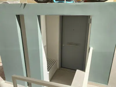a hallway with a door in a building at ErexthionDiony2Apartments in Athens