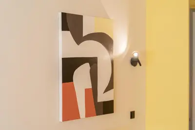 a painting of the number four on a wall at Elegant Suite - Aiolou Street in Athens