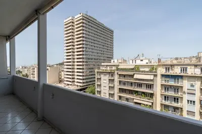 an apartment balcony with a view of buildings at Kifisias View Apartment 2 in Athens