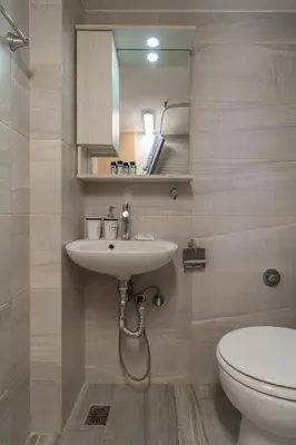 a bathroom with a sink and a toilet at Kifisias View Apartment 2 in Athens
