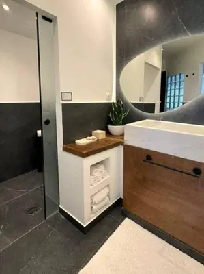 a bathroom with a sink and a mirror at Epicurus Loft in Athens