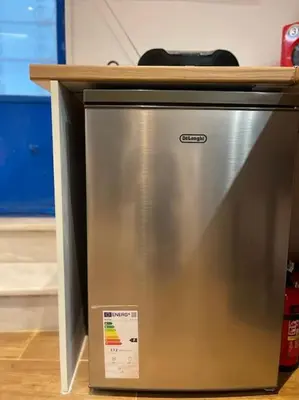 a metal refrigerator with a counter top on top of it at Akropole 700 m Koukaki Merkez in Athens