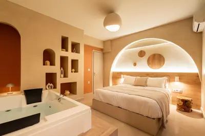 a bedroom with a bed and a bath tub at Gaia Nest in Piraeus