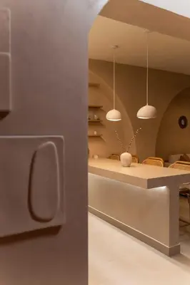 a kitchen with a table and a dining room at Gaia Nest in Piraeus