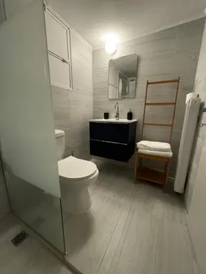 a bathroom with a toilet and a sink at Acropolis central and comfortable apartment in Athens