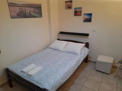 a bedroom with a bed with two white pillows on it at Φιλόξενο studio στο Γαλάτσι in Athens