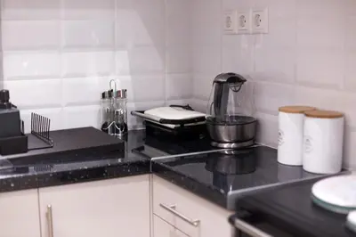 a kitchen counter with a blender on a counter top at Athens City Studio in Athens