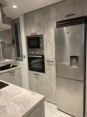 a kitchen with a stainless steel refrigerator and a microwave at Diamond apartment in Athens