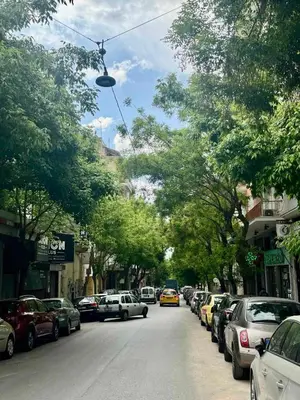 a city street with cars parked on the side of the road at Artemis Suite by Zeussuites in Athens