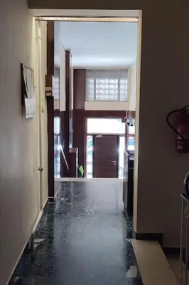 a hallway with an open door to a room at Bisou d' Athènes 1 in Athens