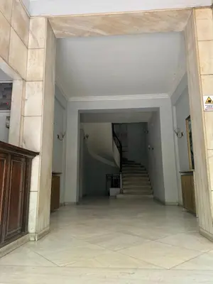 an empty hallway with stairs in a building at Erato suite by Zeussuites in Athens