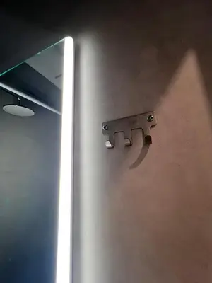a metal door with a handle on a wall at Aris Suite by Zeussuites in Athens