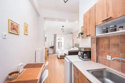 a kitchen with a sink and a counter top at Beautiful central apartment next to the Metro in Athens