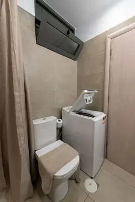 a small bathroom with a toilet and a shower at Urban Maisons in Athens