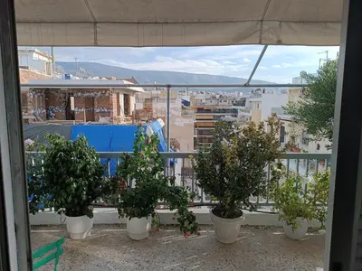 a group of potted plants sitting on a balcony at Central 2-Bedroom penthouse in Athens