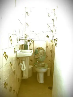 a bathroom with a toilet and a sink at Central 2-Bedroom penthouse in Athens