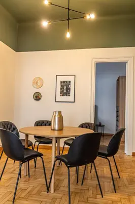 a dining room with a table and chairs at Vintage Acropolis Retreat Charming 3-Bdrm in Koukaki in Athens