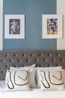 a bedroom with blue walls and a bed with white pillows at Vintage Acropolis Retreat Charming 3-Bdrm in Koukaki in Athens