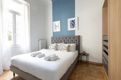 a bedroom with a large bed with towels on it at Vintage Acropolis Retreat Charming 3-Bdrm in Koukaki in Athens