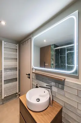 a bathroom with a sink and a large window at Alfalfa Pagrati - Stylish Apartment near Caravel & Center in Athens