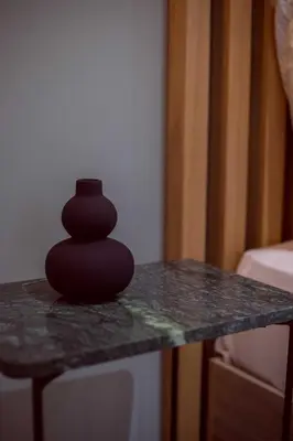 a black vase sitting on top of a table at CHIC and MODERN THISSIOs APARTMENT in Athens