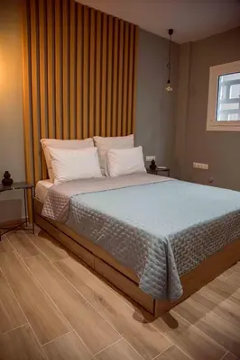 a bedroom with a large bed with white pillows at CHIC and MODERN THISSIOs APARTMENT in Athens