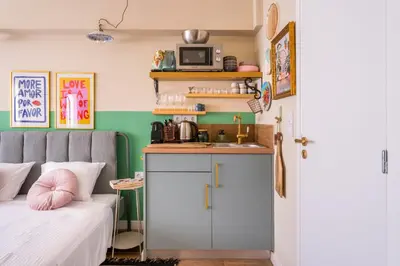 a bedroom with a bed and a sink and a counter at Hellinikos Suite - few steps from Acropolis in Athens