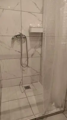 a bathroom with a shower with a shower curtain at Marilyn Residence II in Athens