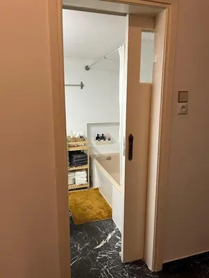 a bathroom with a walk in shower and a mirror at Kallithea Nest by Mancris in Athens