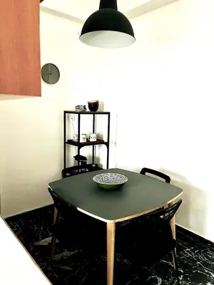 a dining room table with a bowl on top of it at Kallithea Nest by Mancris in Athens