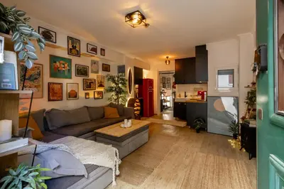 a living room with a couch and a table at The loft in Athens
