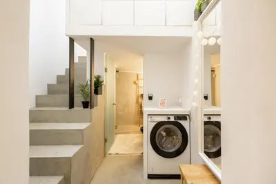 a laundry room with a washer and dryer at The loft in Athens